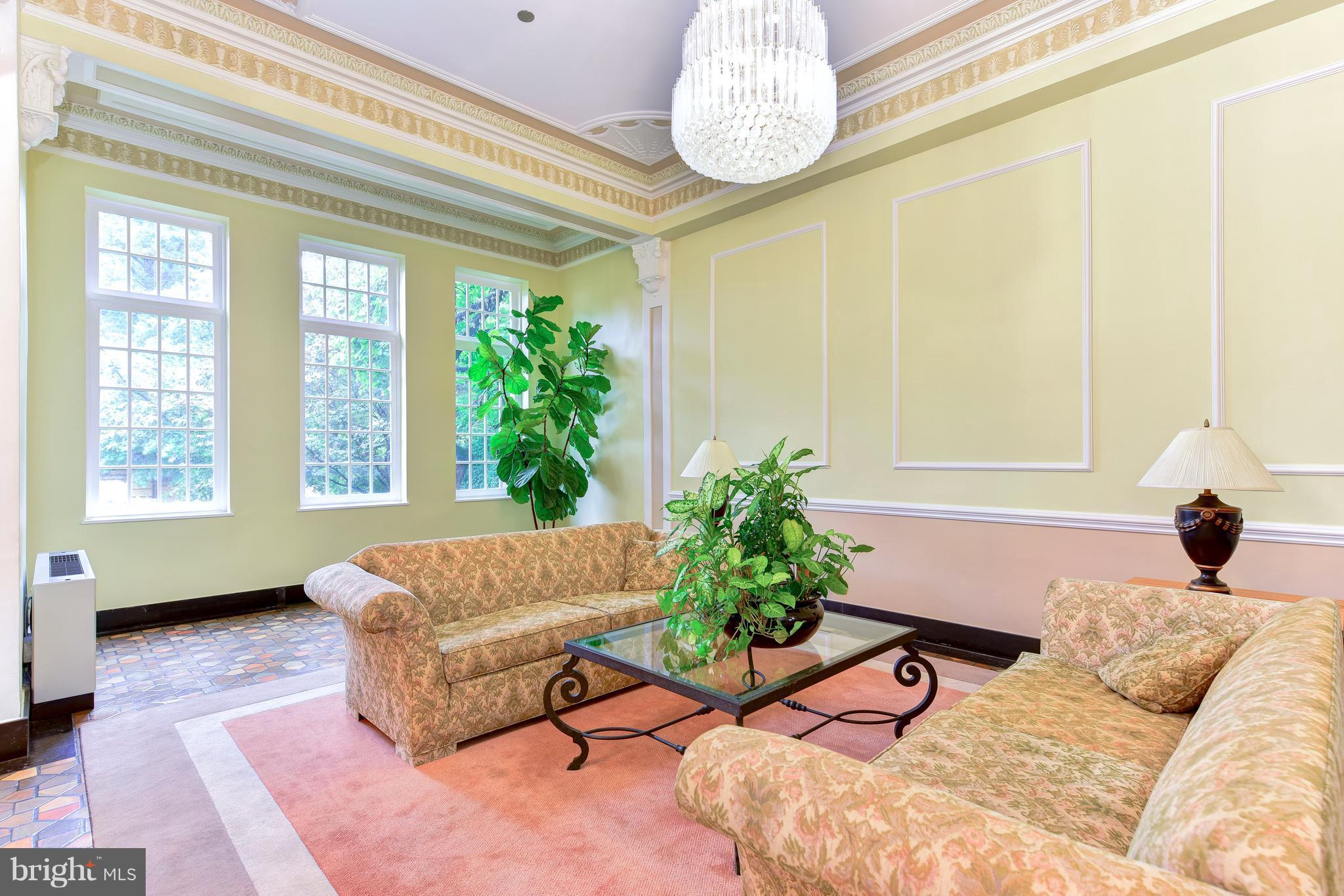 2440 16th Street Northwest, Unit 412 Washington, DC 20009 - Photo 4 of 25 a bedroom with a bed and a potted plant