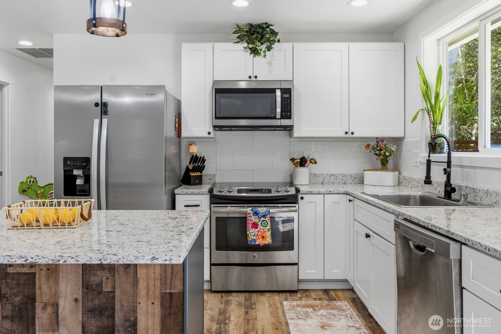690 North Summit Road McCleary, WA 98557 - Photo 20 of 40 a kitchen with stainless steel appliances granite countertop a stove refrigerator and microwave