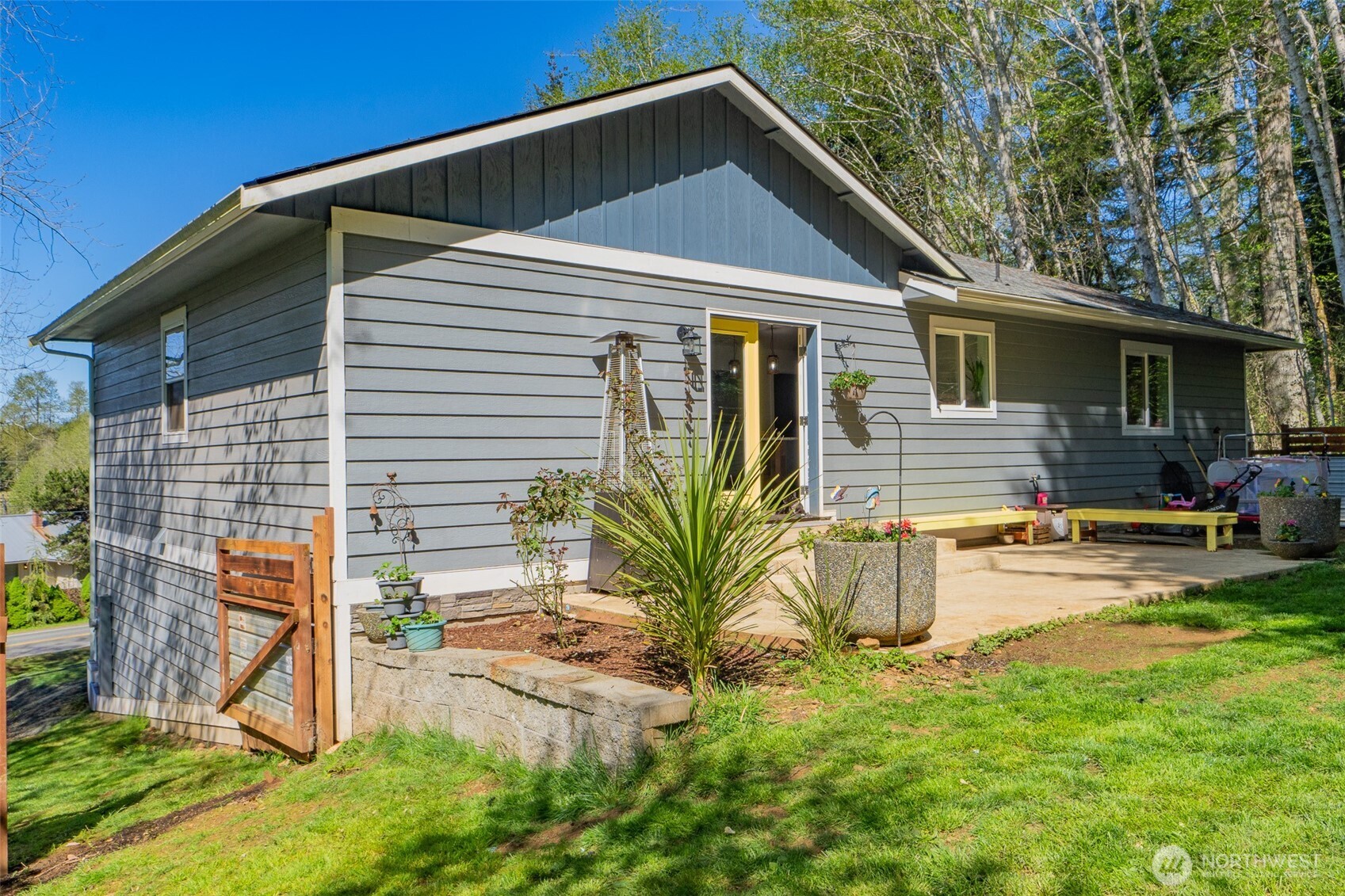690 North Summit Road McCleary, WA 98557 - Photo 7 of 40 a view of a house with backyard and sitting area