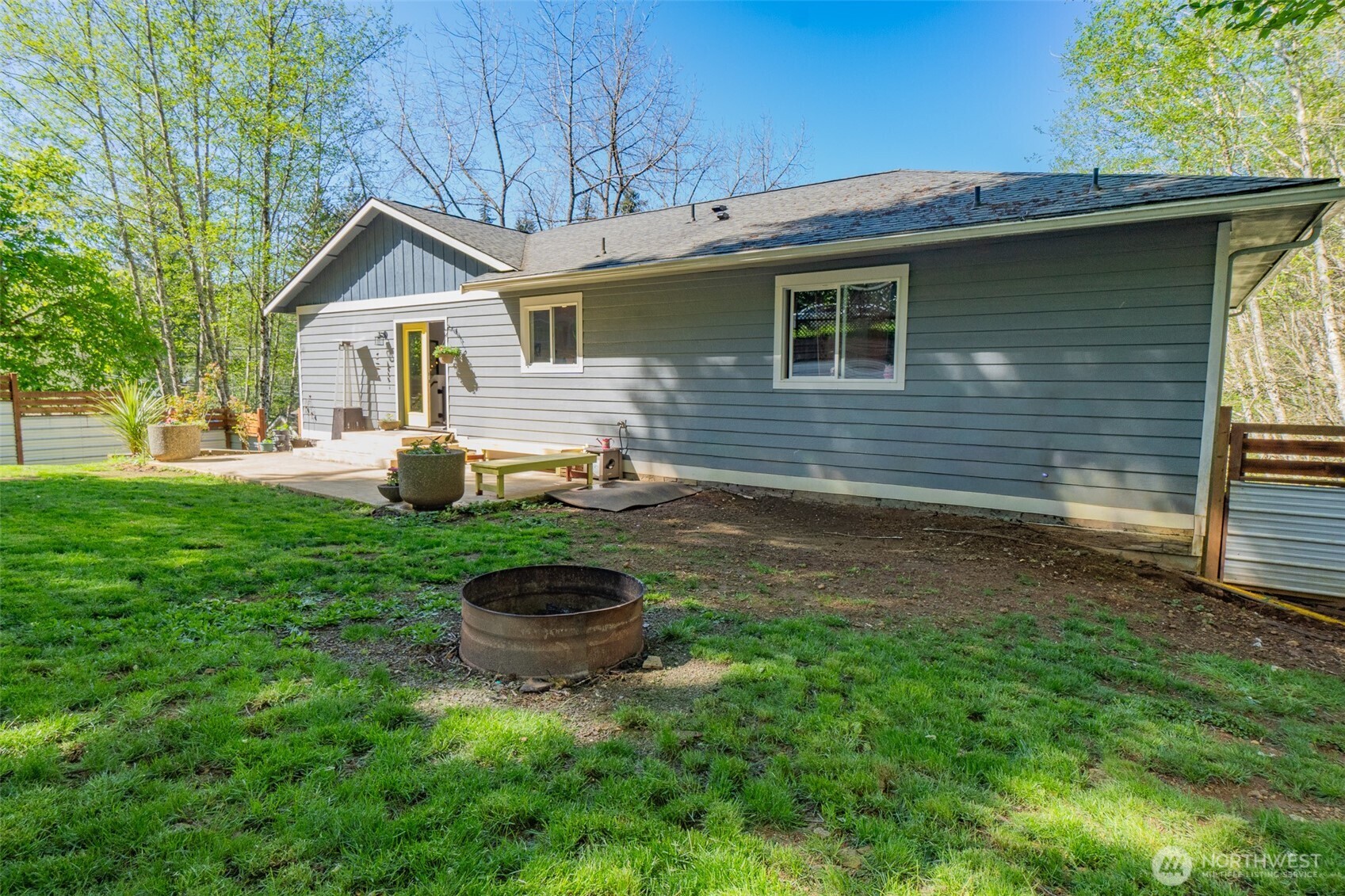 690 North Summit Road McCleary, WA 98557 - Photo 8 of 40 a backyard of a house with barbeque oven