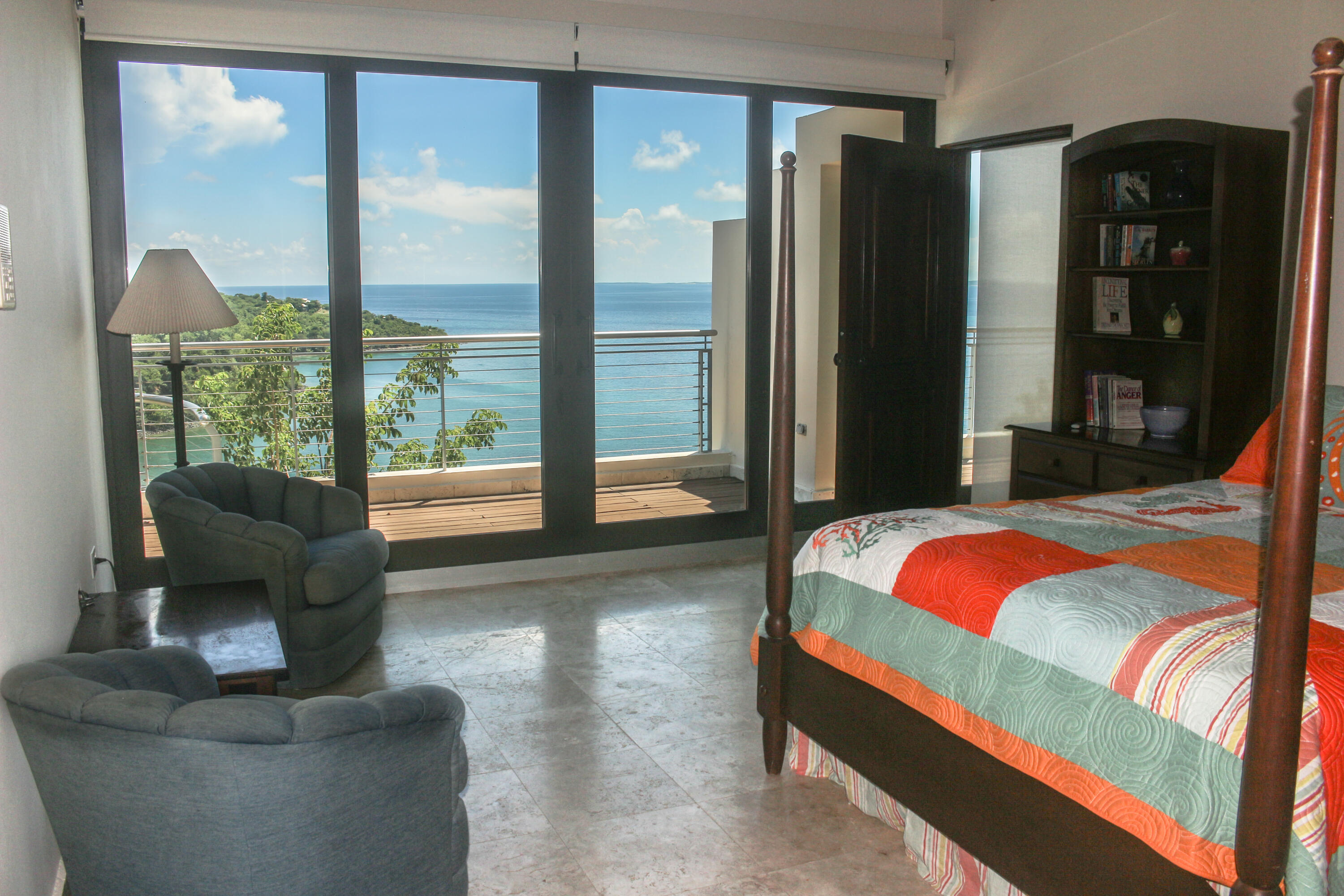 1 Southeast Harbor Estates Culeba, PR 00775 - Photo 28 of 56 a bedroom with a bed and glass walk in closet