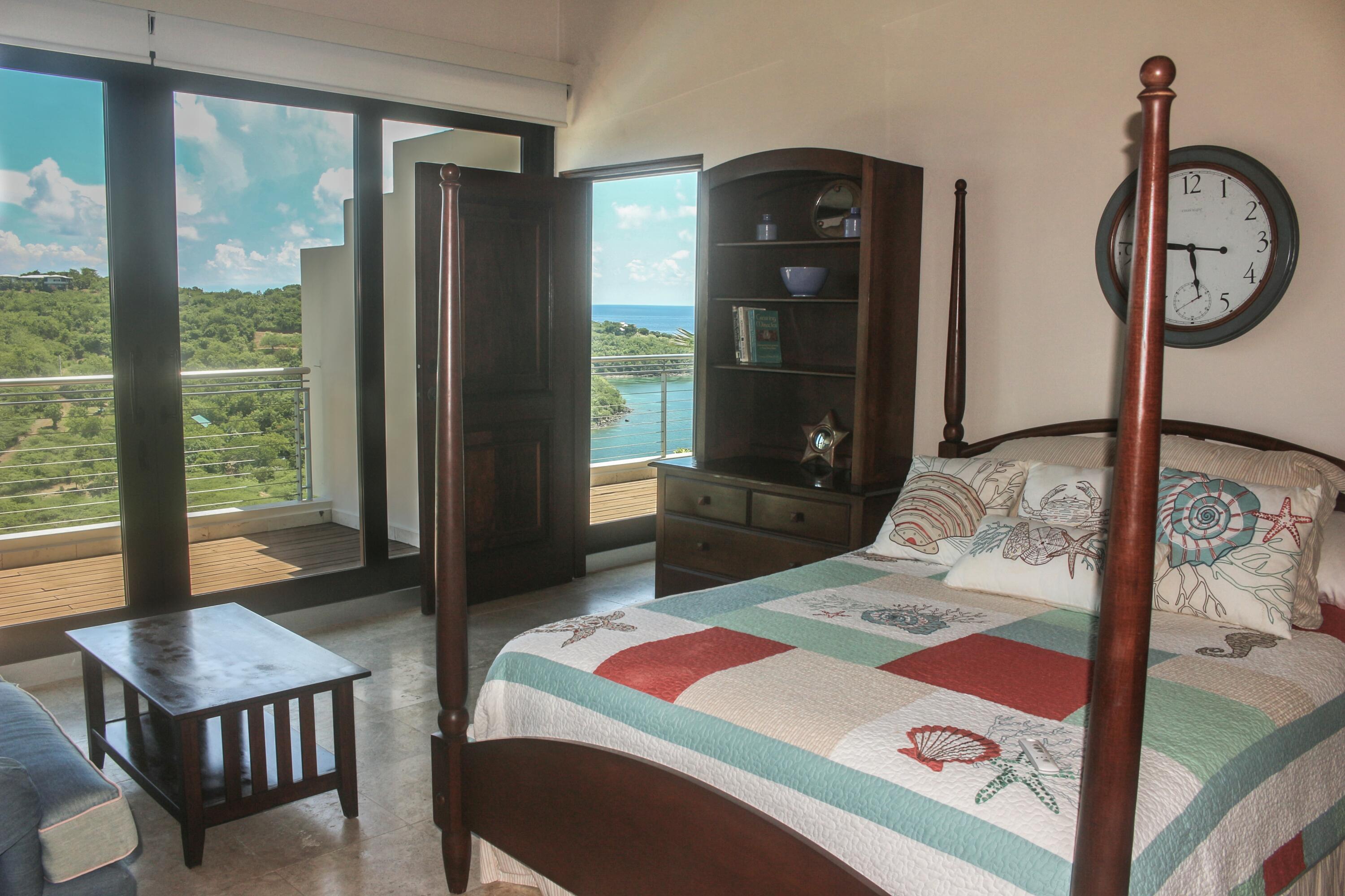 1 Southeast Harbor Estates Culeba, PR 00775 - Photo 36 of 56 a bedroom with a bed dresser and a window