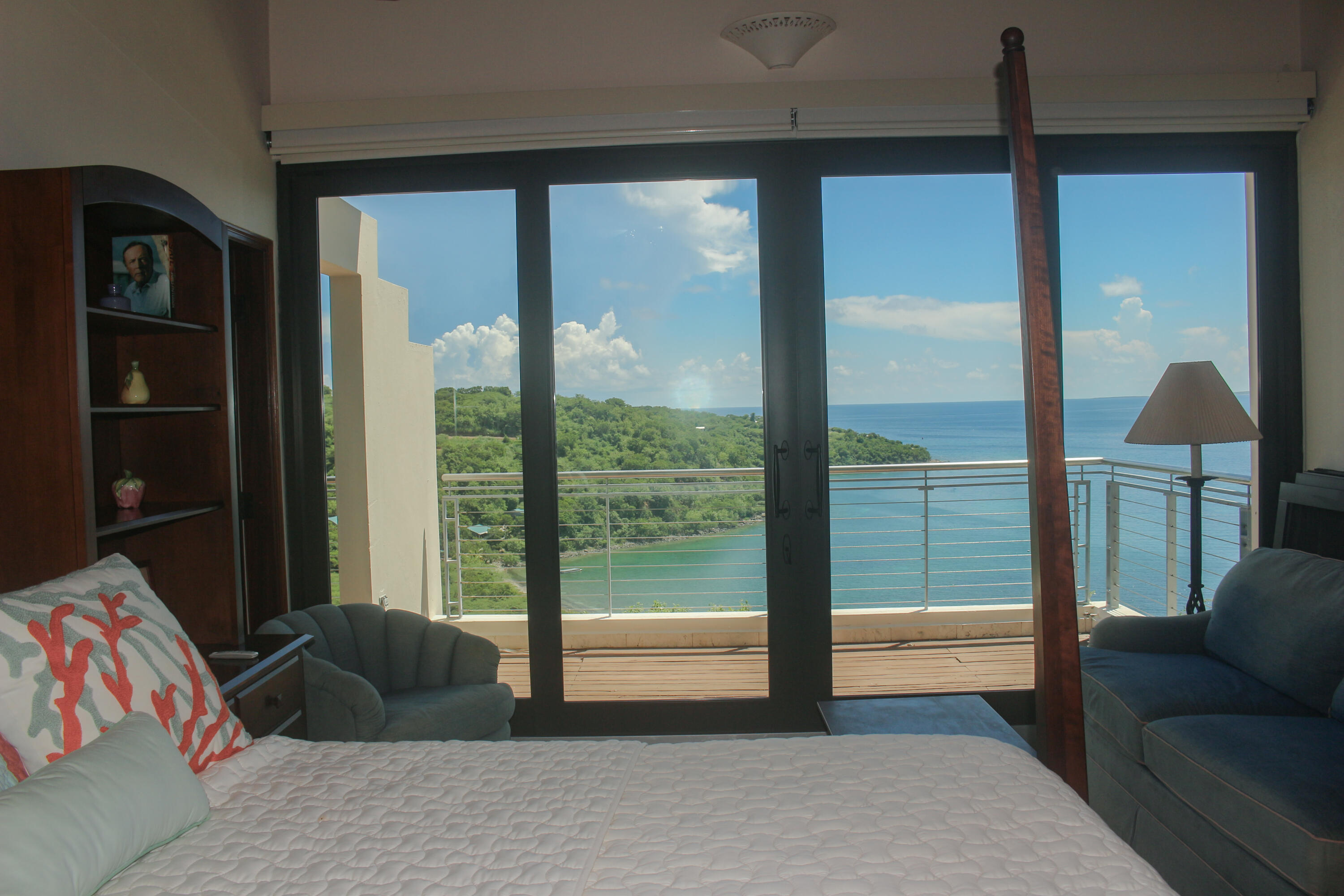 1 Southeast Harbor Estates Culeba, PR 00775 - Photo 38 of 56 a bedroom with a bed and a lamp next to a window