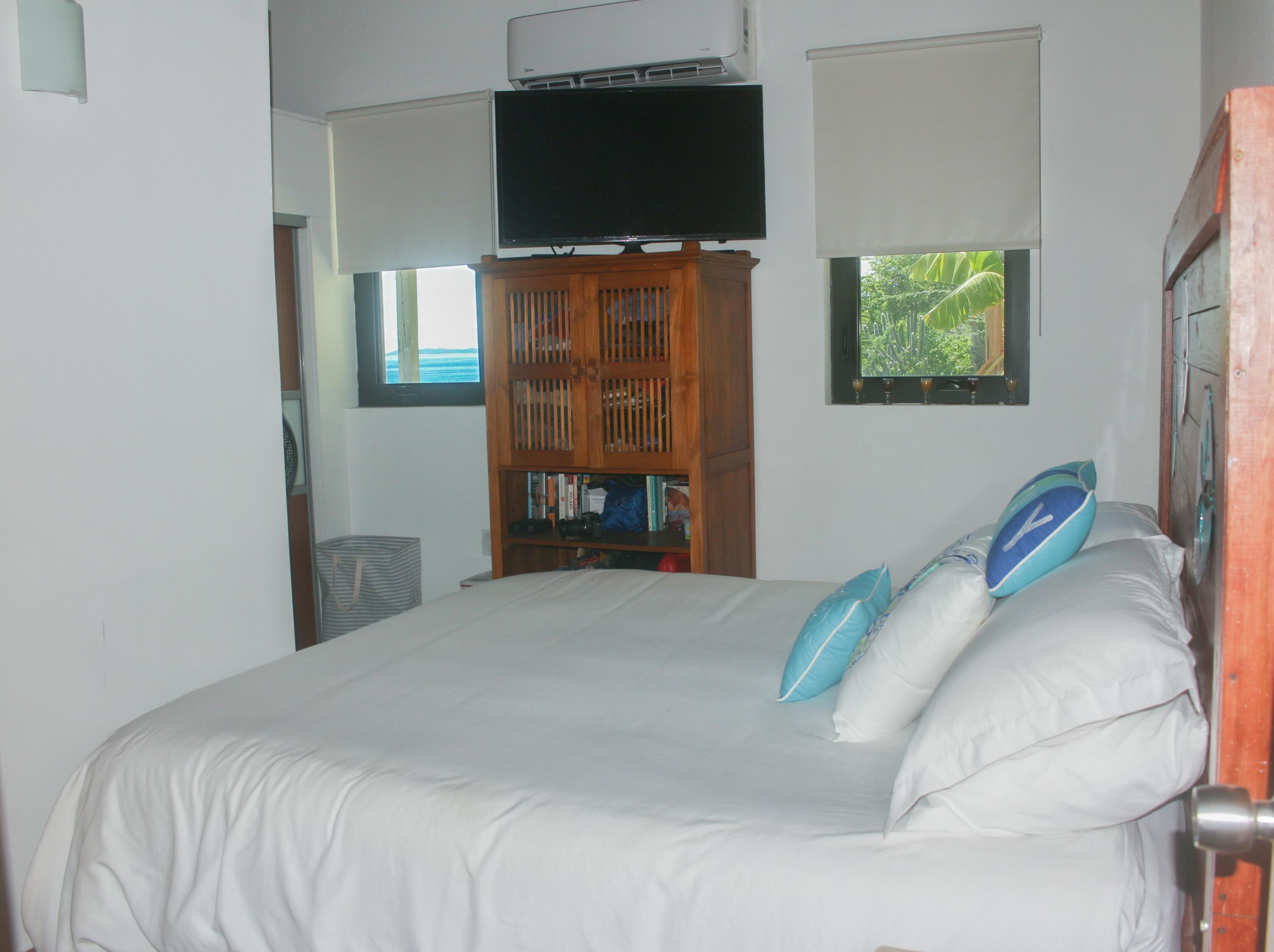 1 Southeast Harbor Estates Culeba, PR 00775 - Photo 43 of 56 a bedroom with a bed and a flat screen tv