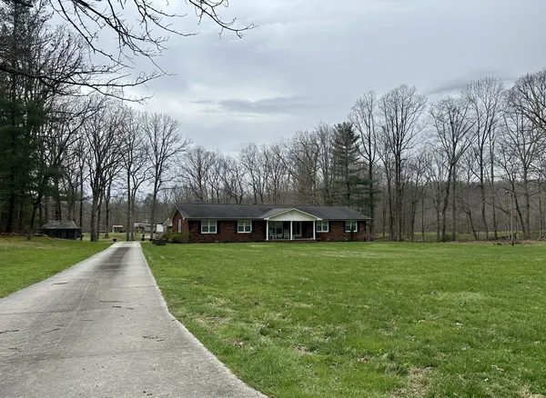 a view of a house with a yard