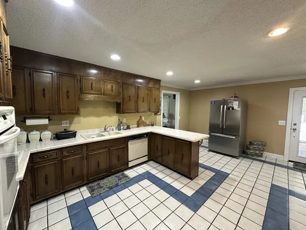 a kitchen with a sink and cabinets