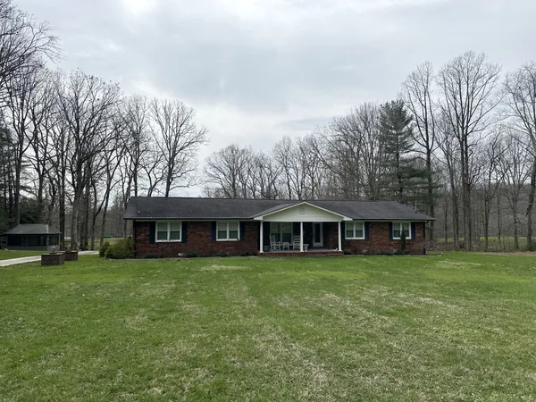 a view of a backyard of the house