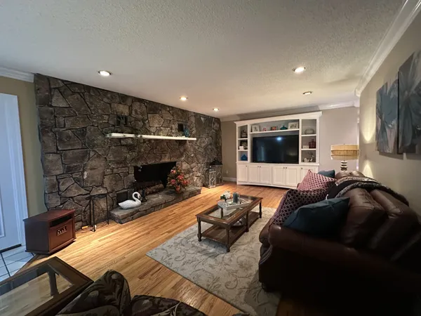 a living room with furniture and a fireplace