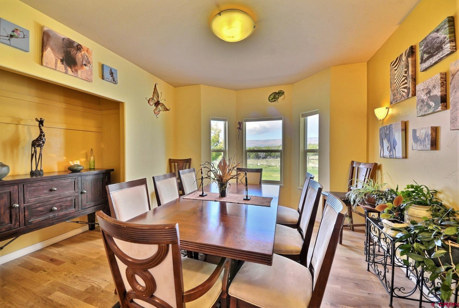 15423 2525th Road Cedaredge, CO 81413 - Photo 11 of 35 a view of a dining room with furniture and a potted plant