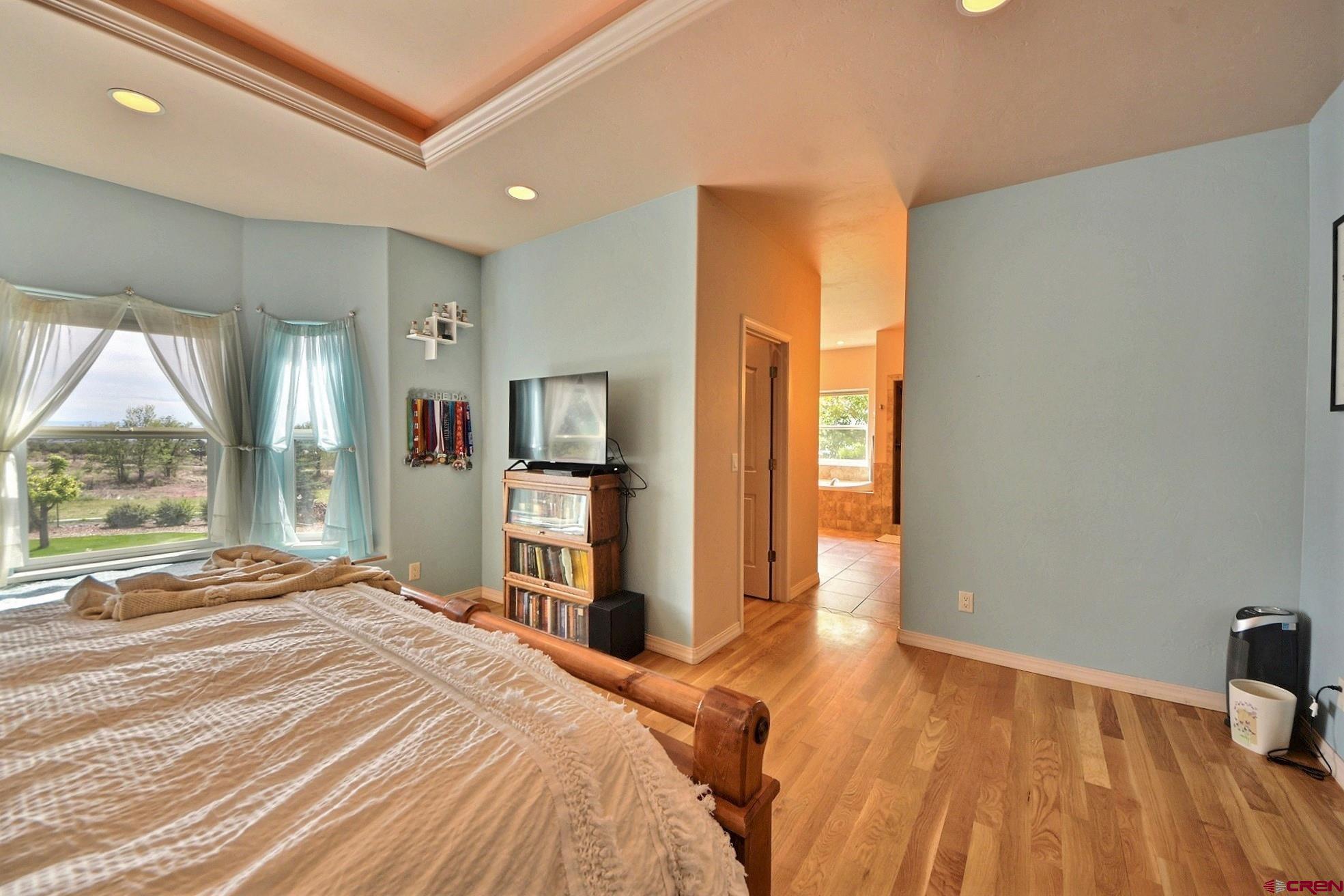 15423 2525th Road Cedaredge, CO 81413 - Photo 13 of 35 a bedroom with a bed and a large window