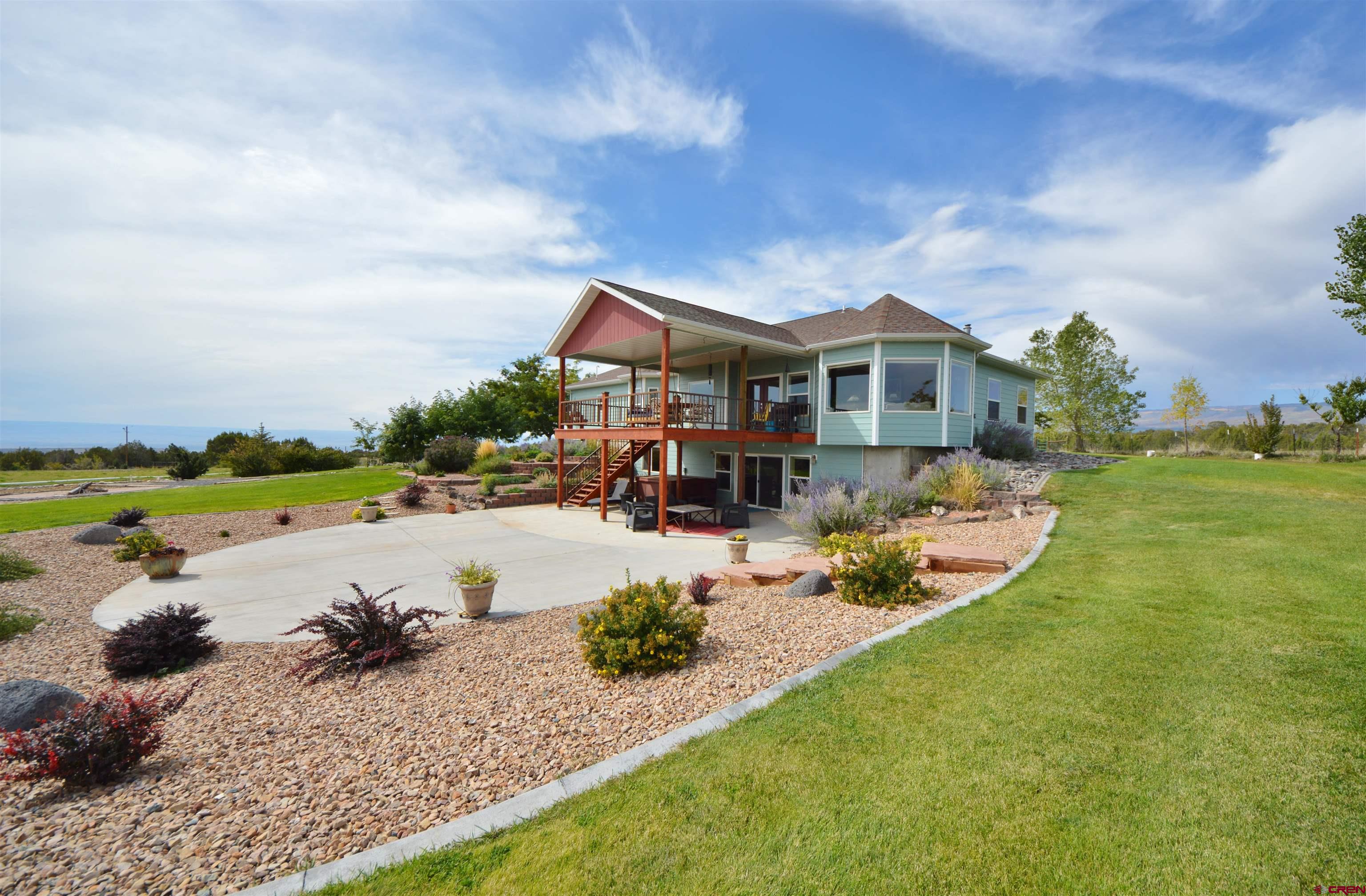 15423 2525th Road Cedaredge, CO 81413 - Photo 25 of 35 a view of a house with swimming pool and sitting area