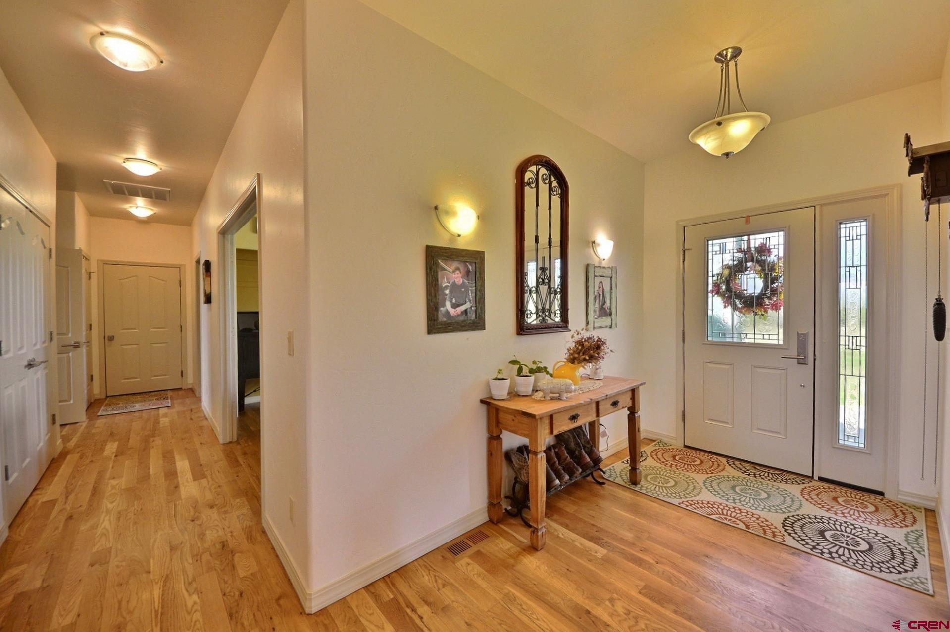15423 2525th Road Cedaredge, CO 81413 - Photo 3 of 35 a view of a room with wooden floor and furniture