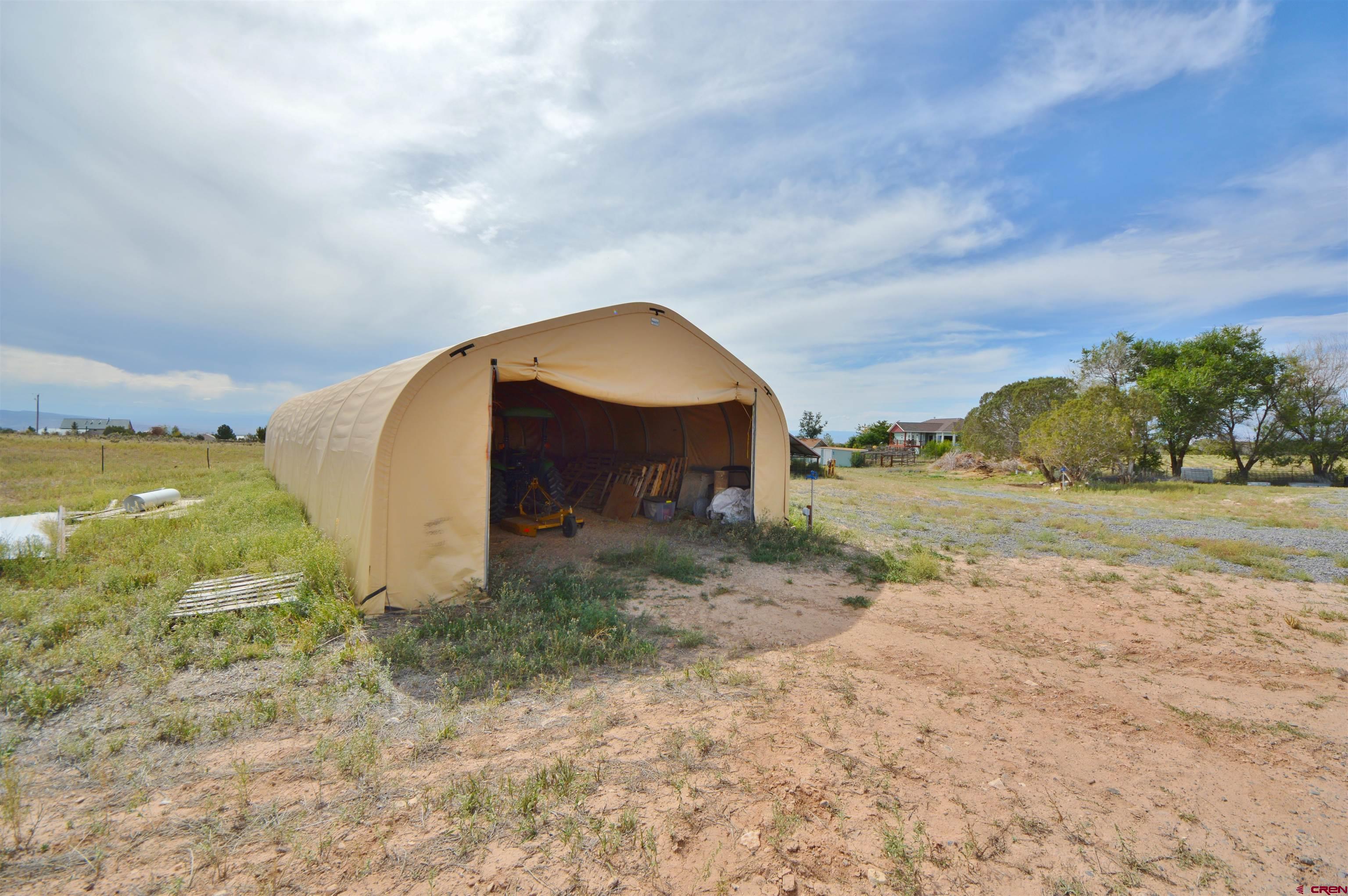 15423 2525th Road Cedaredge, CO 81413 - Photo 31 of 35 a view of a yard with an outdoor space