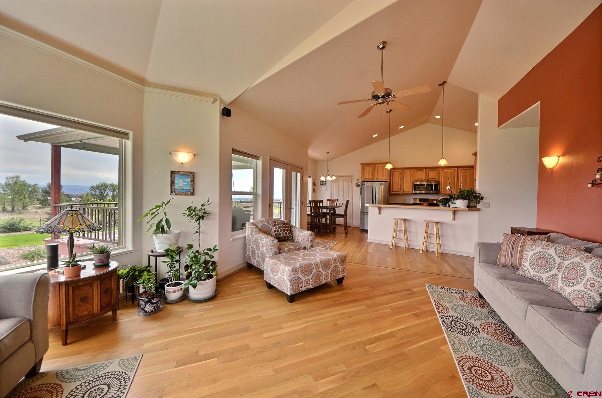 15423 2525th Road Cedaredge, CO 81413 - Photo 6 of 35 a living room with furniture kitchen view and large windows