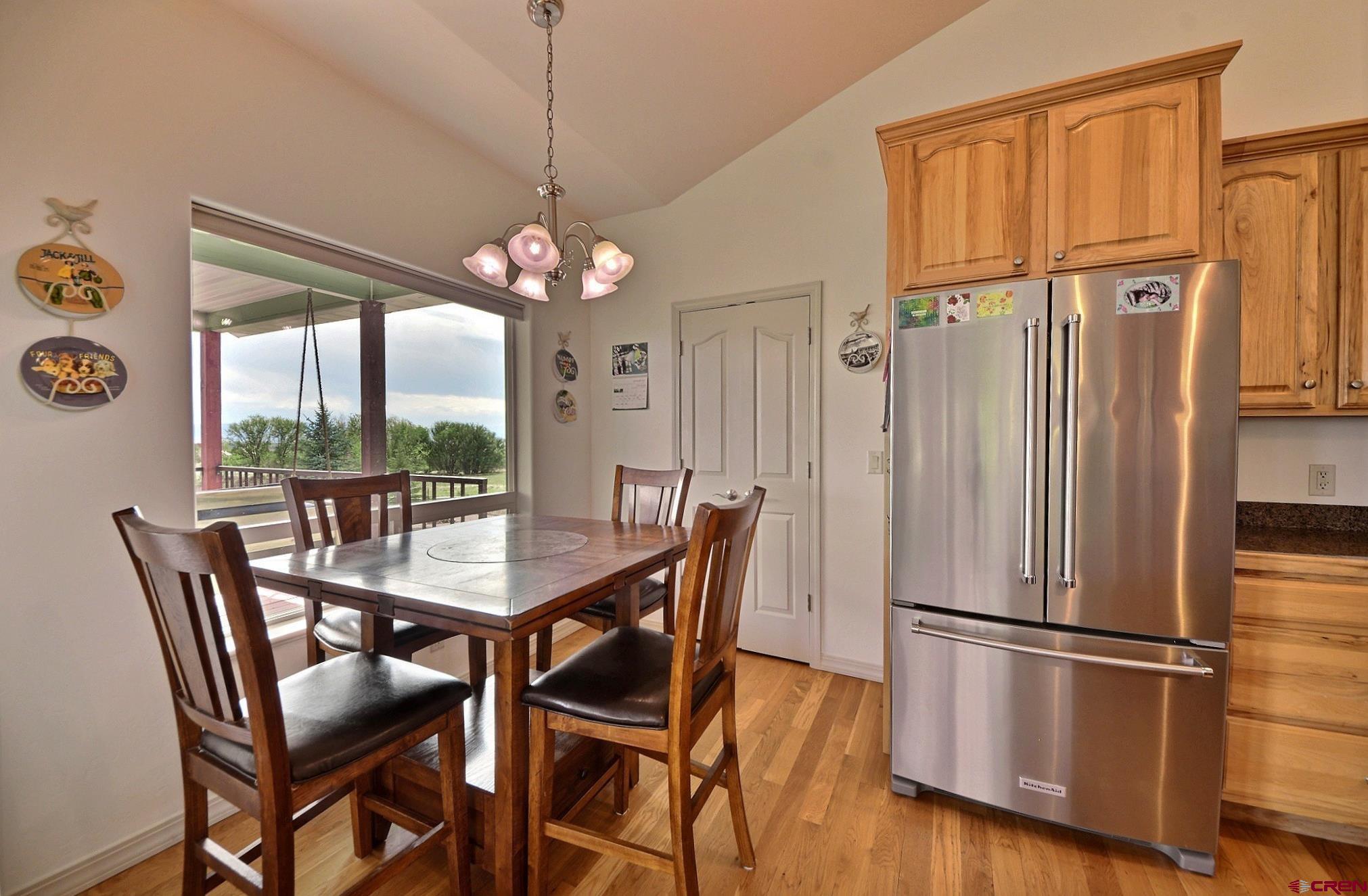 15423 2525th Road Cedaredge, CO 81413 - Photo 8 of 35 a dining room with furniture window and wooden floor