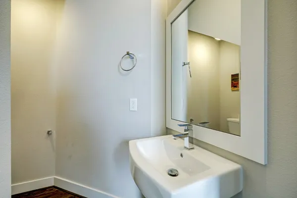a bathroom with a sink and mirror
