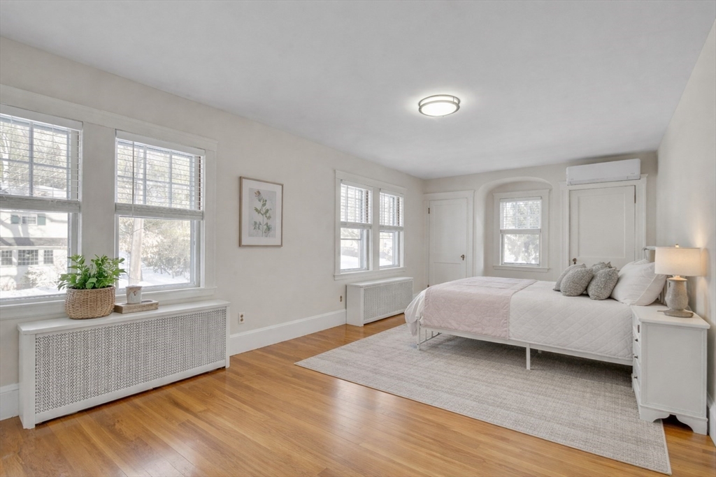 10 Dexter Road Lexington, MA 02420 - Photo 17 of 30 a spacious bedroom with a bed and wooden floor