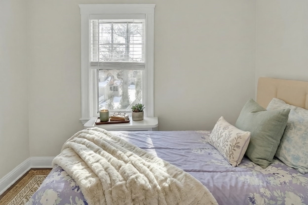 10 Dexter Road Lexington, MA 02420 - Photo 19 of 30 a bedroom with a bed and window