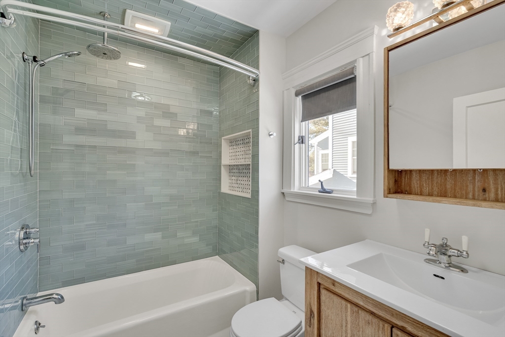 10 Dexter Road Lexington, MA 02420 - Photo 20 of 30 a bathroom with a sink toilet and shower