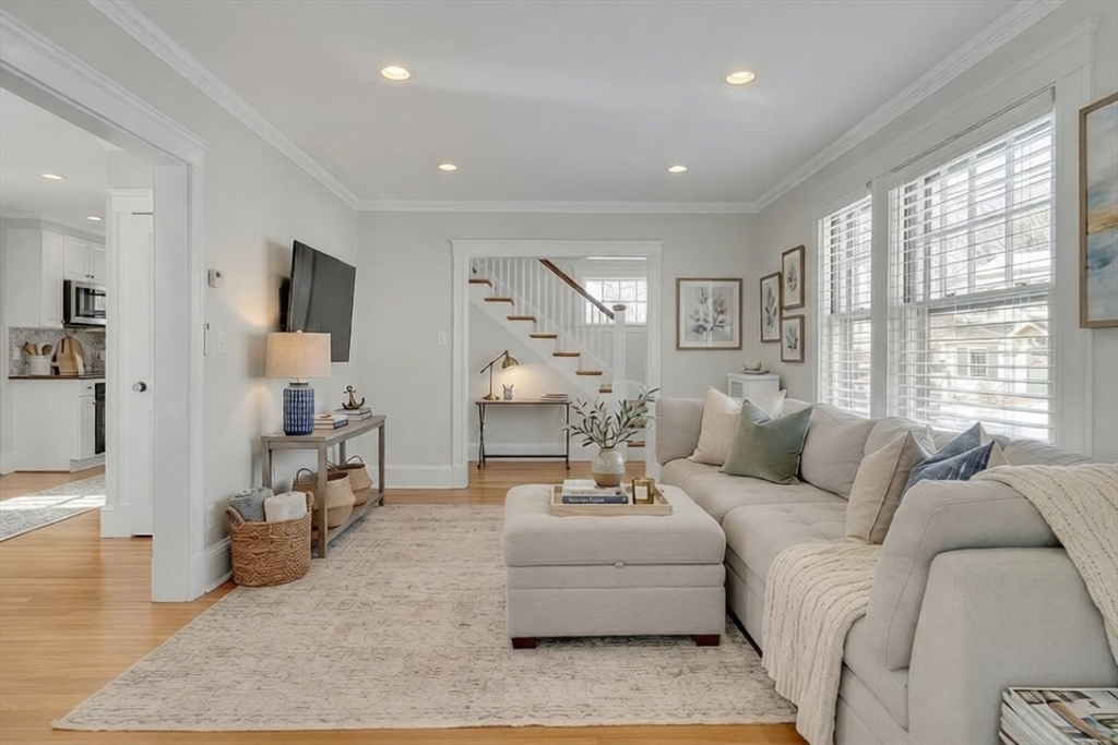 10 Dexter Road Lexington, MA 02420 - Photo 2 of 30 a living room with furniture and a large window