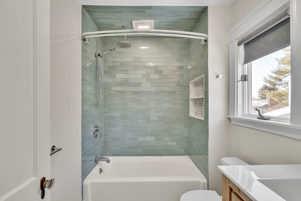 10 Dexter Road Lexington, MA 02420 - Photo 21 of 30 a bathroom with a bathtub and a shower