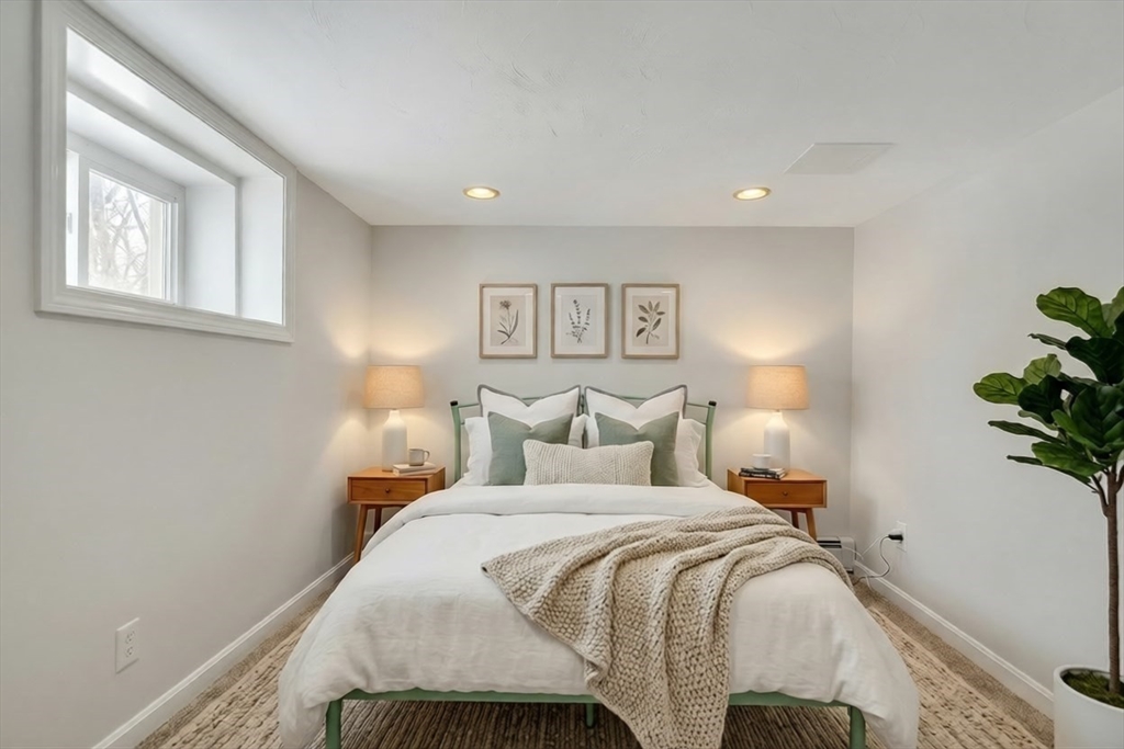 10 Dexter Road Lexington, MA 02420 - Photo 26 of 30 a bedroom with a bed and a painting on the wall