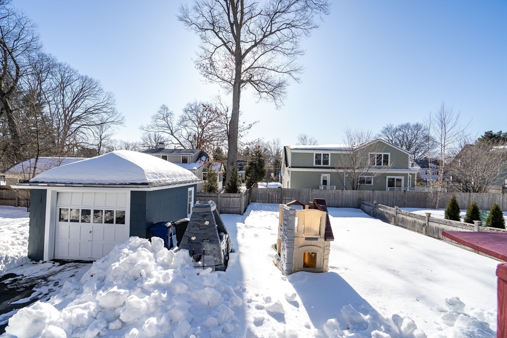 10 Dexter Road Lexington, MA 02420 - Photo 29 of 30 a view of a house with a yard covered in snow