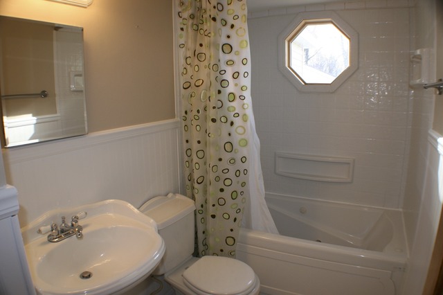 933 Wisconsin Road New Lenox, IL 60451 - Photo 15 of 16 a bathroom with a sink toilet and shower