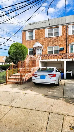 a view of a cars park in front of a building