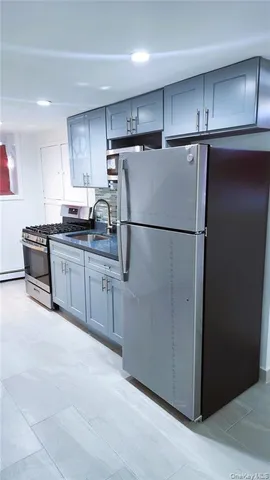a white refrigerator freezer sitting in a kitchen