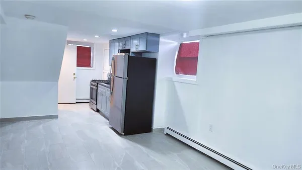 a bathroom with a toilet sink and shower