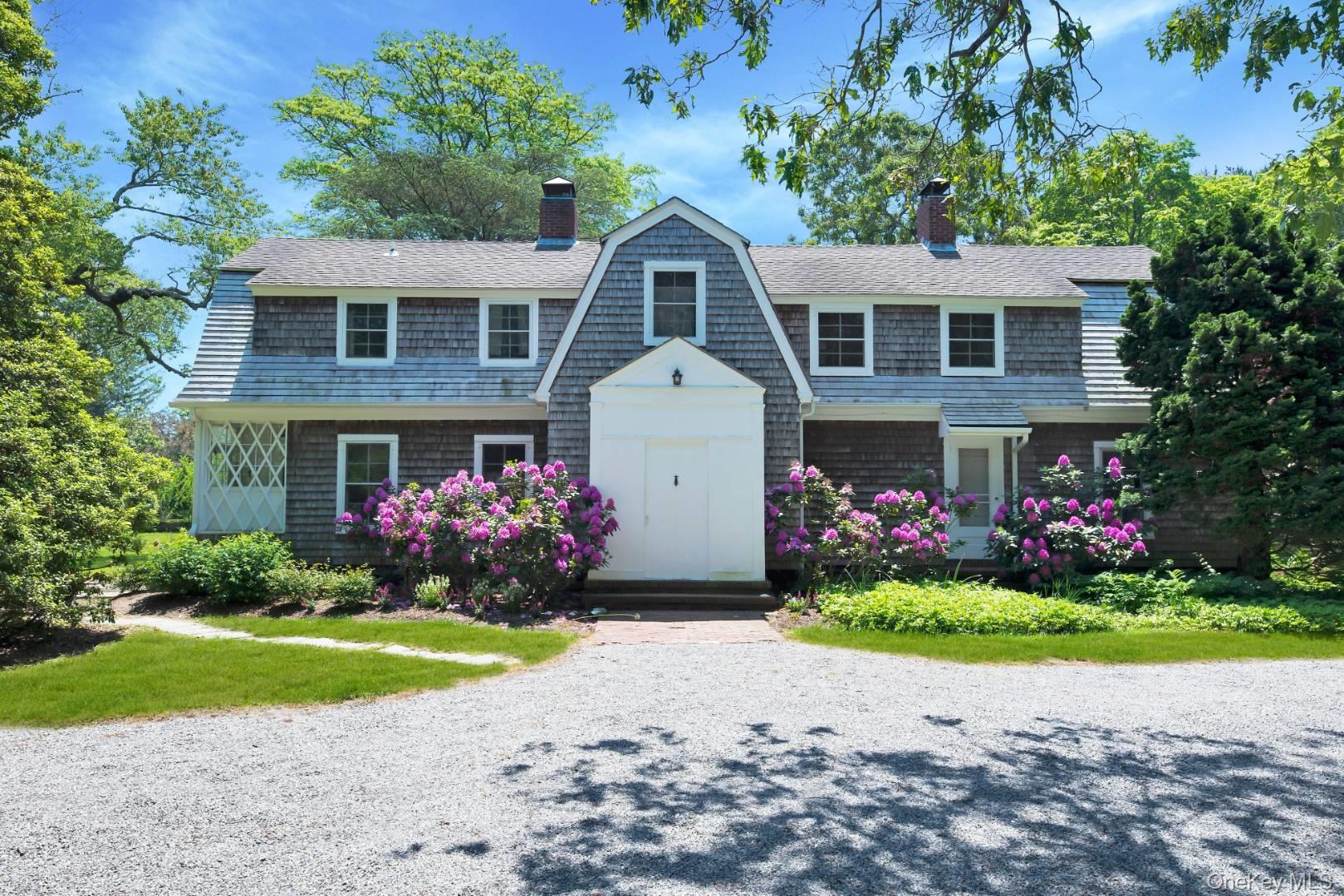 90 Old Depot Road Quogue, NY 11959 - Photo 1 of 21 a front view of house with yard
