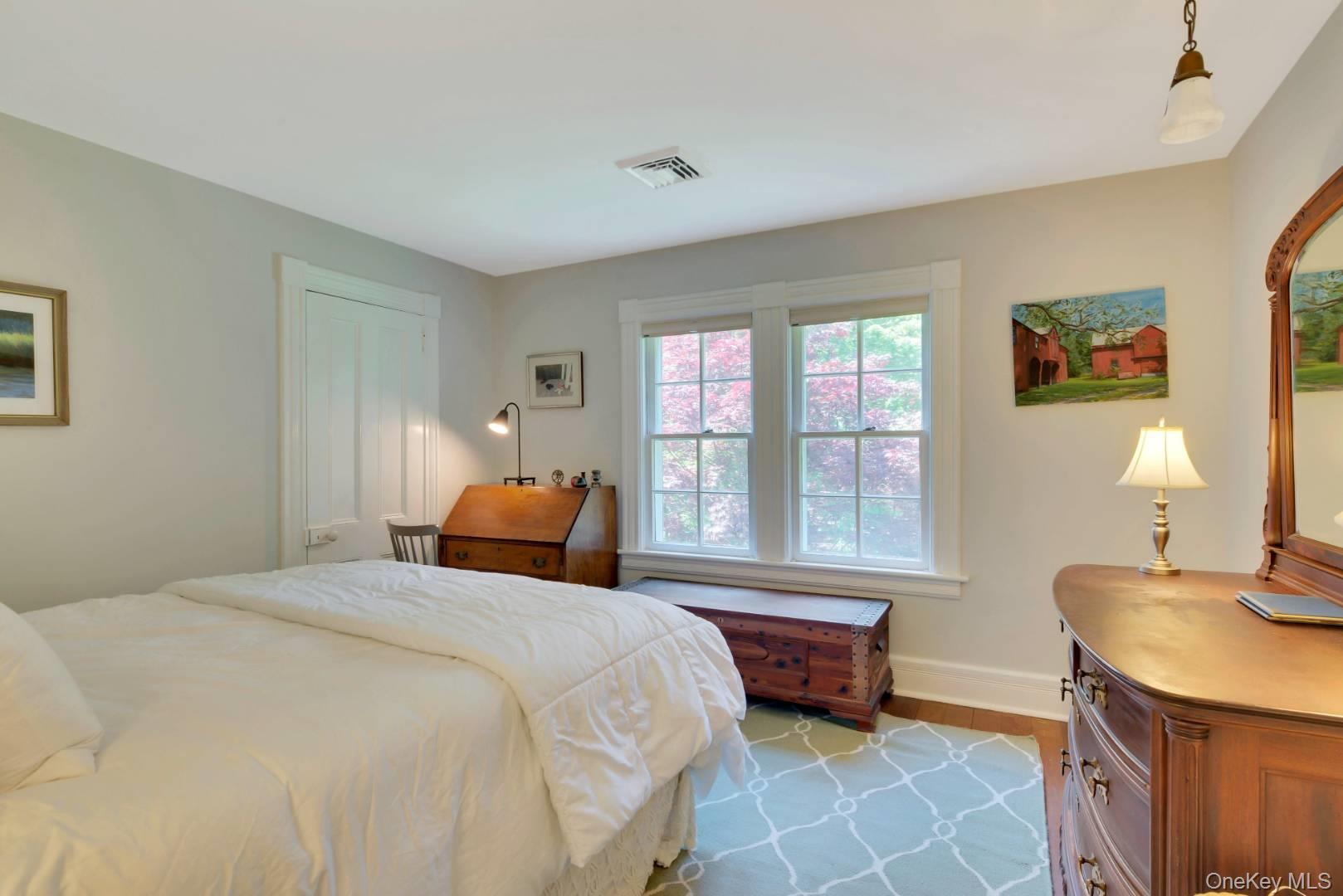 90 Old Depot Road Quogue, NY 11959 - Photo 14 of 21 a bedroom with a bed and a window