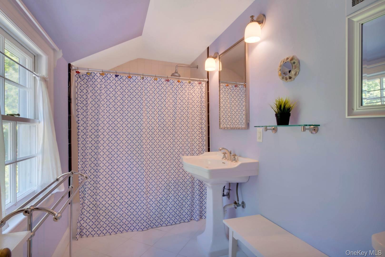 90 Old Depot Road Quogue, NY 11959 - Photo 15 of 21 a bathroom with a sink a mirror and a toilet