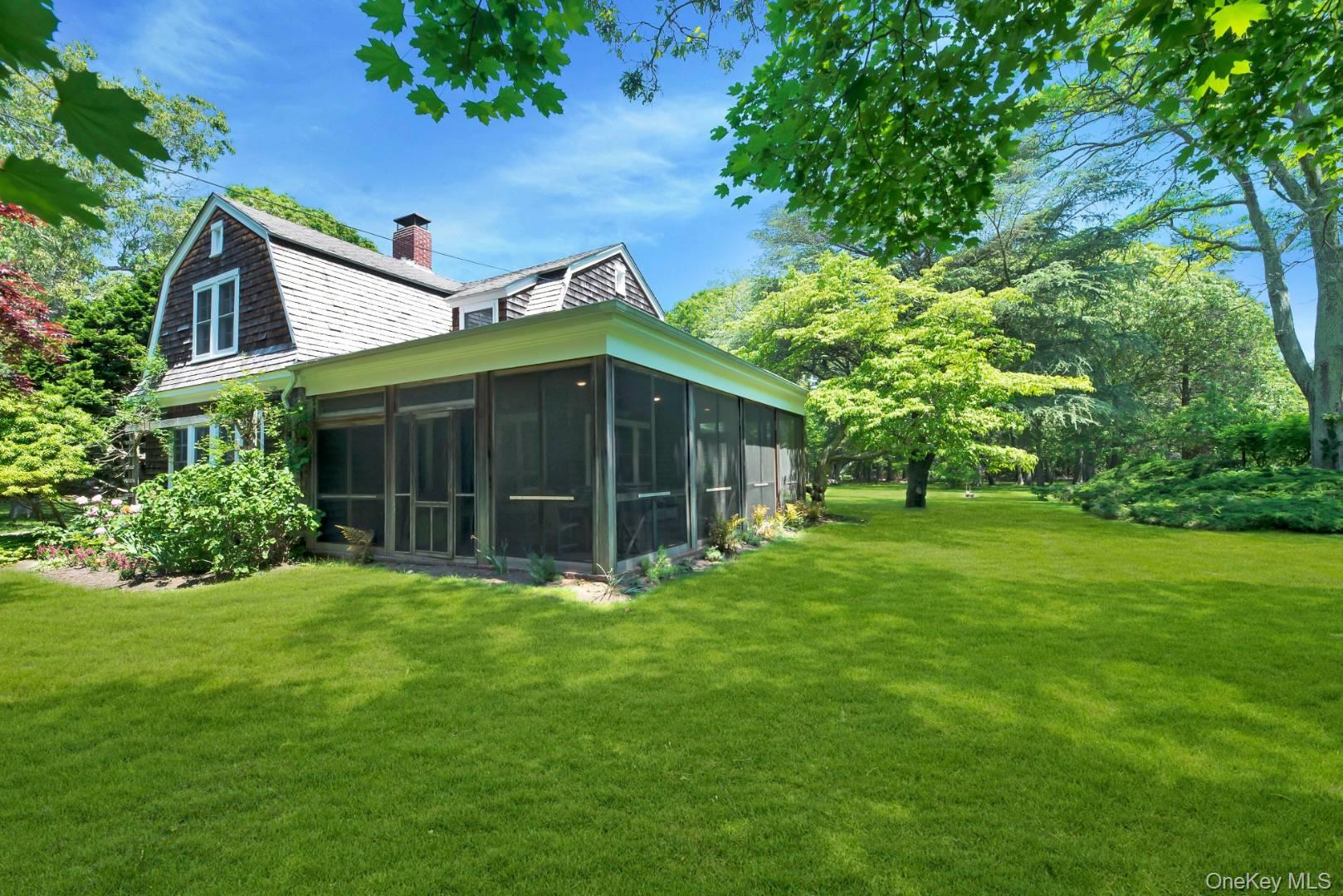 90 Old Depot Road Quogue, NY 11959 - Photo 18 of 21 a view of a house with a yard