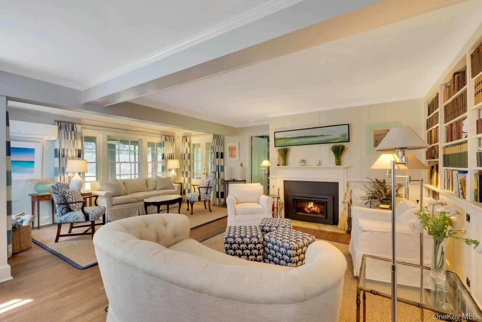 90 Old Depot Road Quogue, NY 11959 - Photo 2 of 21 a living room with furniture and a fireplace