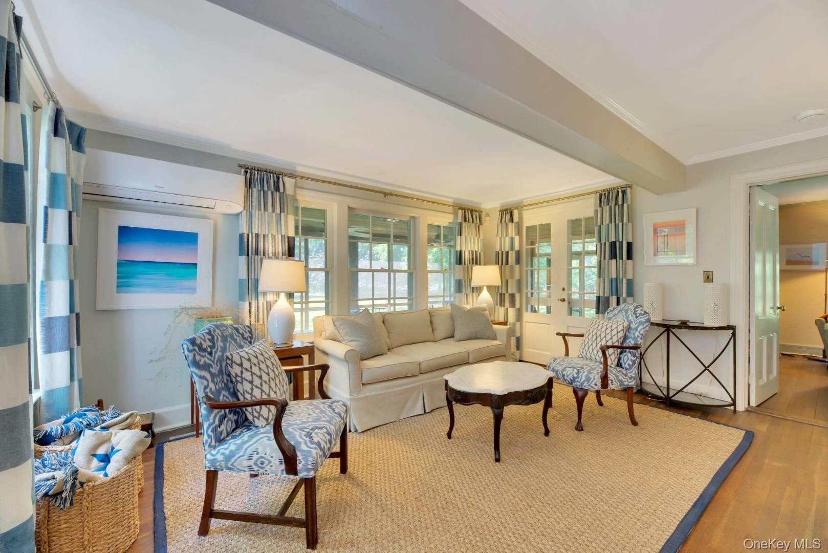90 Old Depot Road Quogue, NY 11959 - Photo 3 of 21 a living room with furniture and a large window