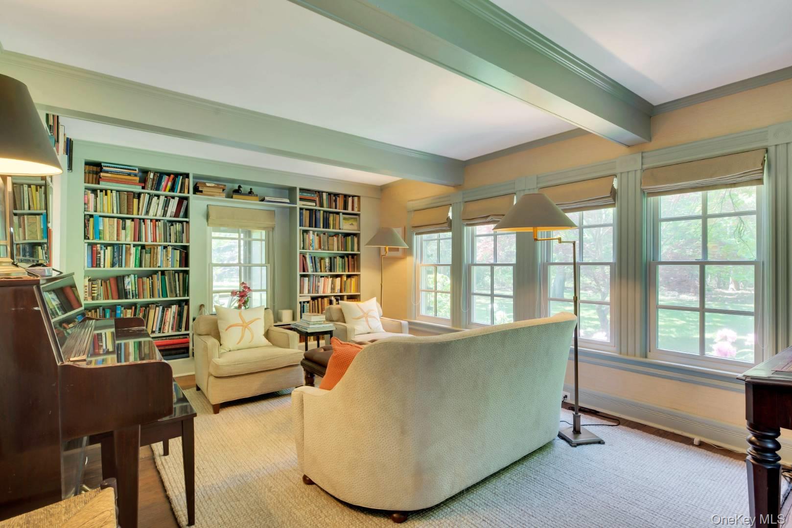 90 Old Depot Road Quogue, NY 11959 - Photo 6 of 21 a living room with furniture and large windows
