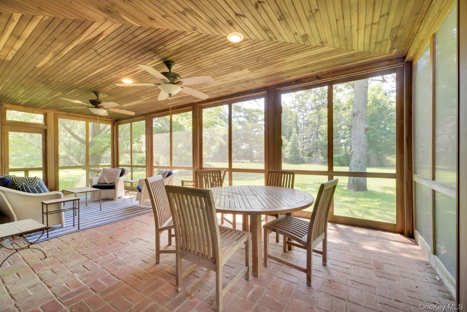 90 Old Depot Road Quogue, NY 11959 - Photo 7 of 21 a view of a dining room with furniture window and outside view