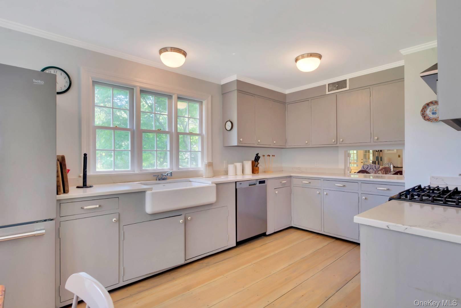90 Old Depot Road Quogue, NY 11959 - Photo 8 of 21 a kitchen with a sink cabinets and window