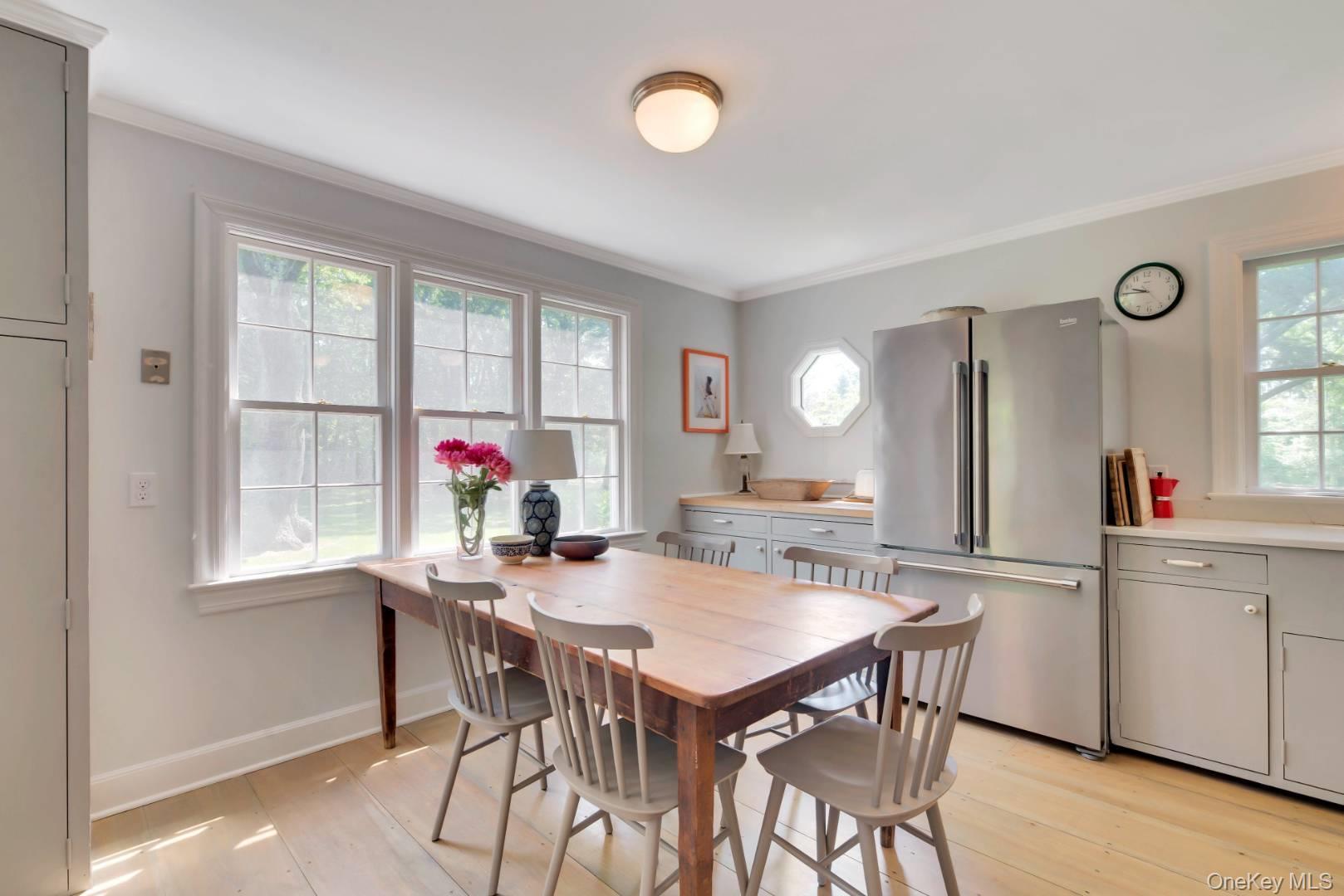 90 Old Depot Road Quogue, NY 11959 - Photo 9 of 21 a view of a dining room with furniture and window