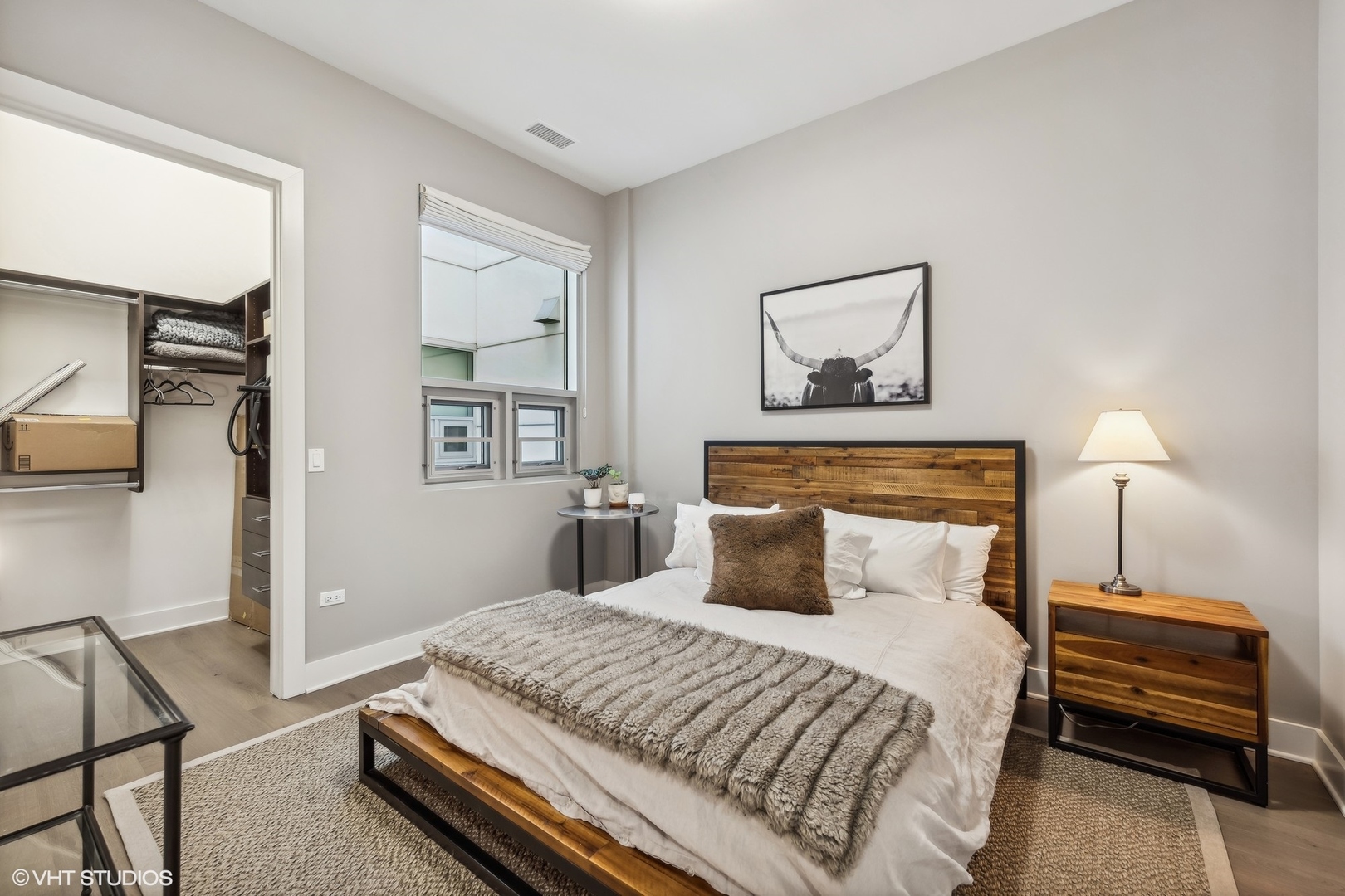 1128 West Adams Street, Unit 4E Chicago, IL 60607 - Photo 16 of 21 a bedroom with a bed and a night stand