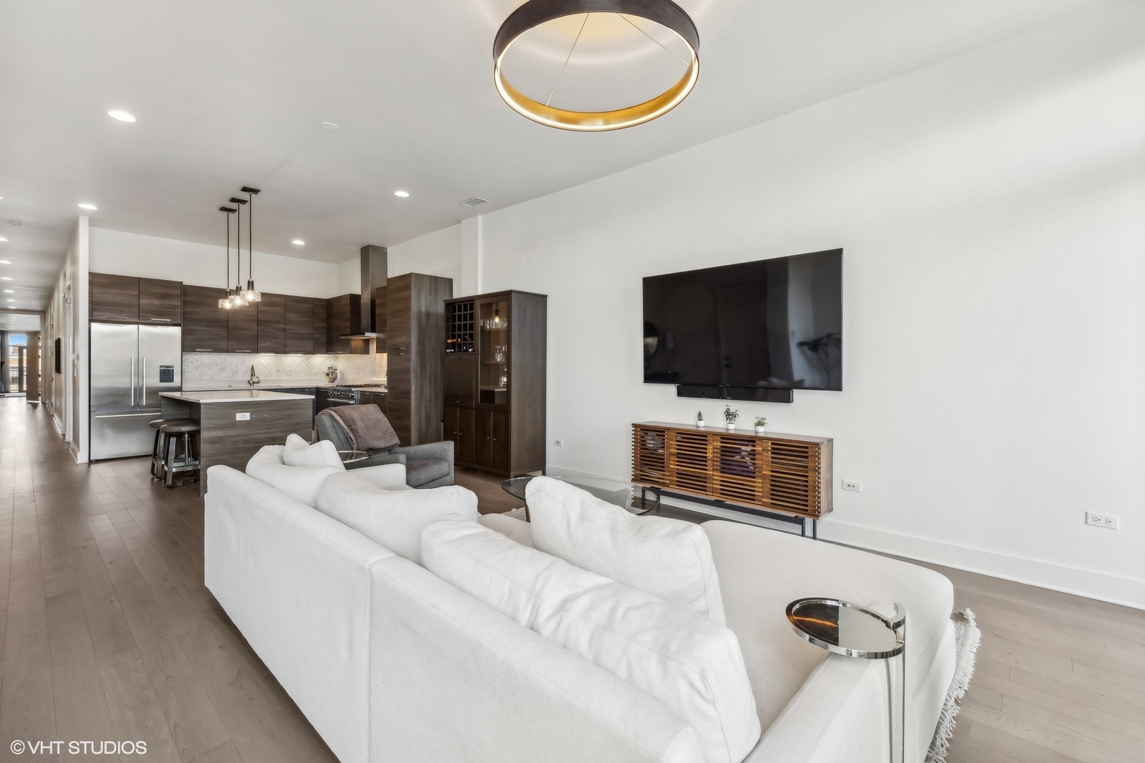1128 West Adams Street, Unit 4E Chicago, IL 60607 - Photo 6 of 21 a living room with furniture and a flat screen tv