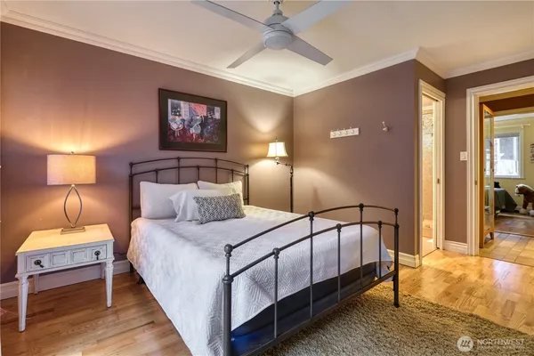 a bedroom with a bed and a lamp