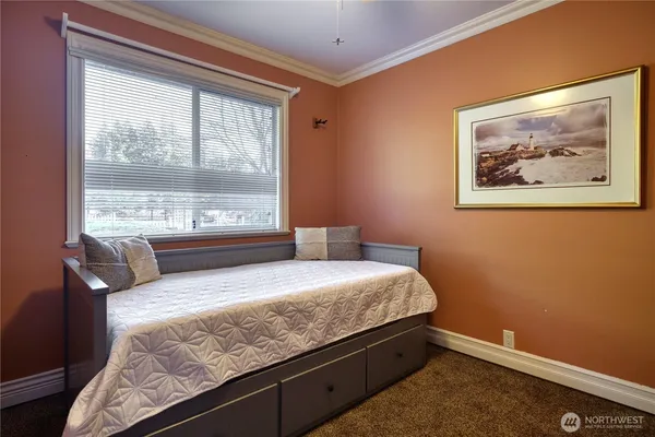 a bedroom with a bed and window