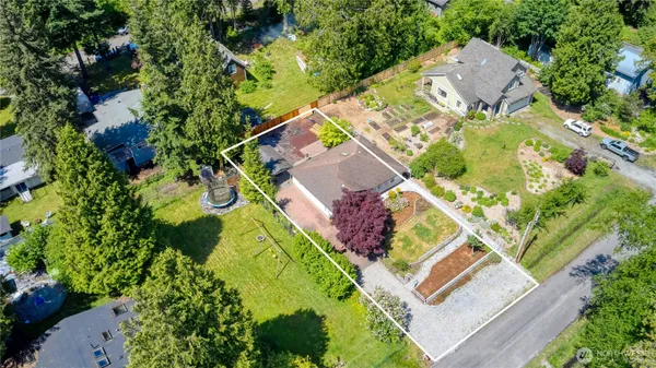 an aerial view of a house with a garden