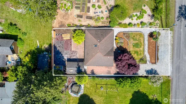 an aerial view of a house with a garden