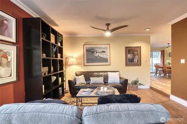 a bedroom with furniture and a book shelf