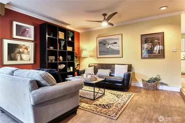a living room with furniture and a rug