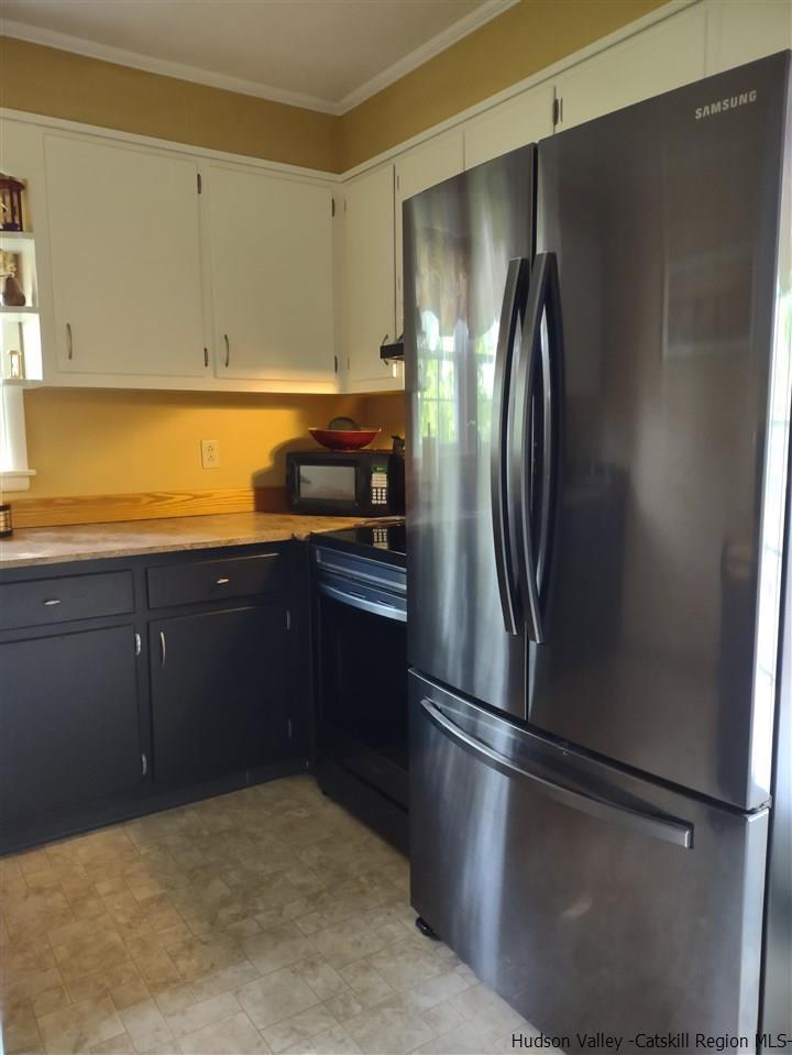 685 Churchland Road Saugerties, NY 12477 - Photo 18 of 30 a kitchen with stainless steel appliances granite countertop a refrigerator and a sink